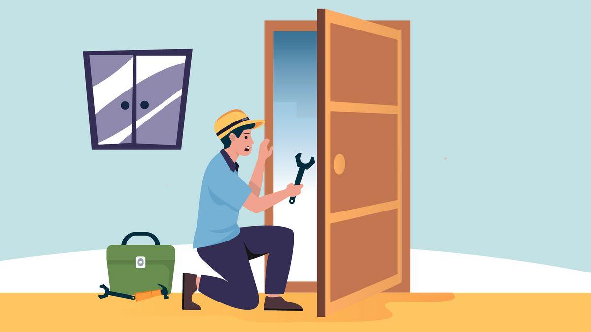 A locksmith opening a door on a building or a house.